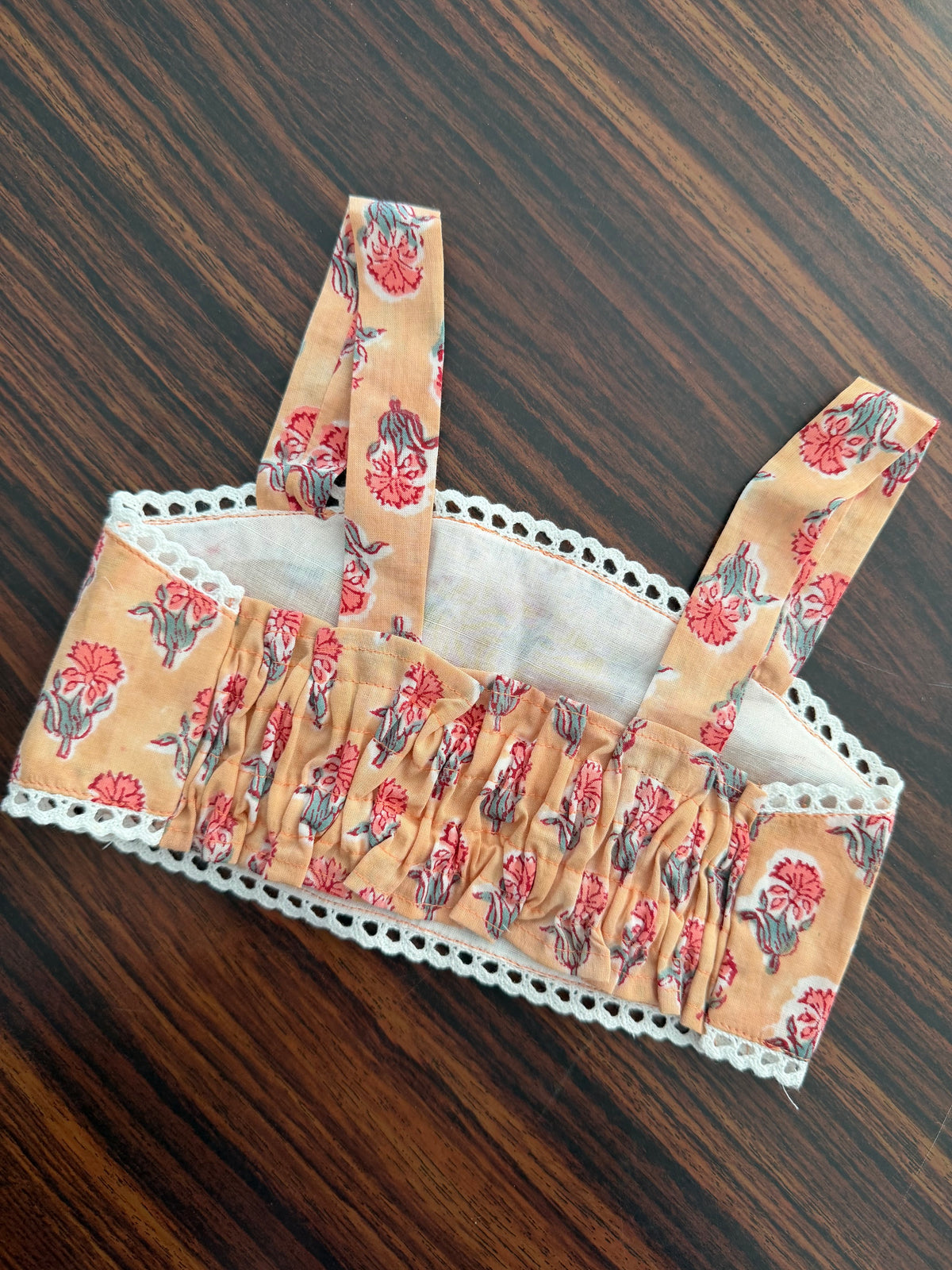 Floral-patterned fabric on a wooden surface