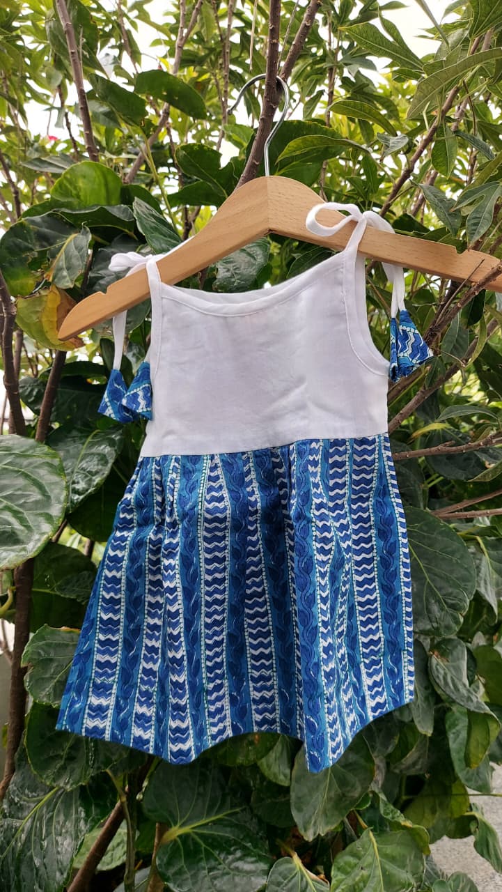 Handmade baby girl knot dress featuring delicate tatting flowers