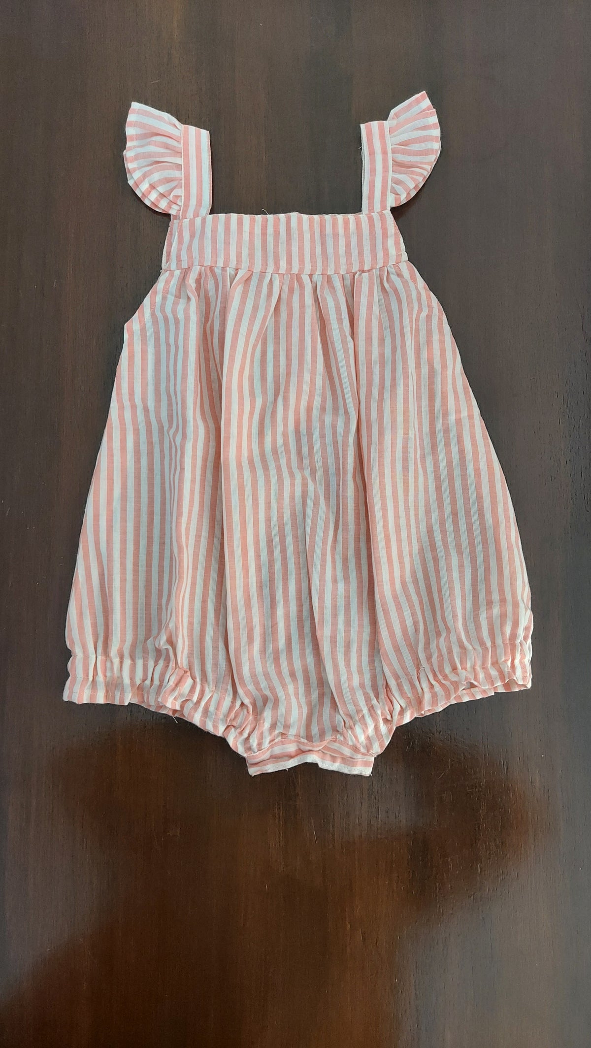 Striped dress on a dark surface