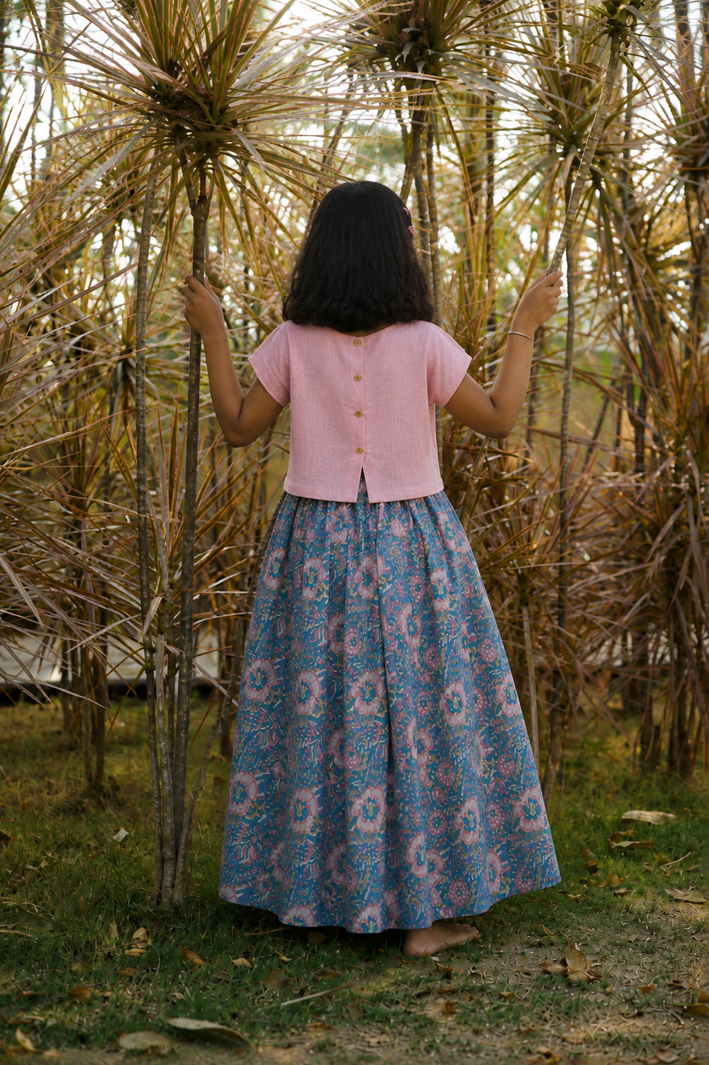 Wooden button on the back of kurta
 