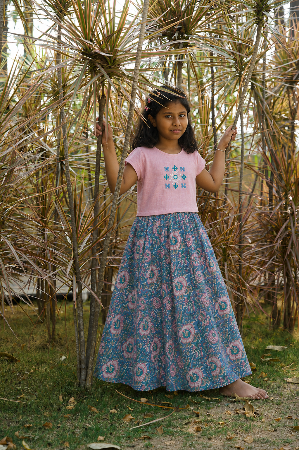 Girl wearing cotton lahenga with a pink khadi blouse 